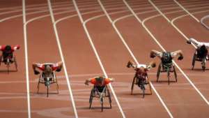 Athletes compete in a heat of the men's 400m T54 event during the 2008 Beijing Paralympic Games at the National Staidium in the Chinese capital on September 8, 2008. AFP PHOTO/Peter PARKS / AFP PHOTO / PETER PARKS